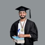 a man wearing a graduation cap and gown holding a book